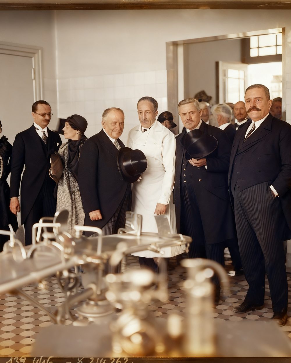 The same group photograph cleaned of spotting and rendered in colour.