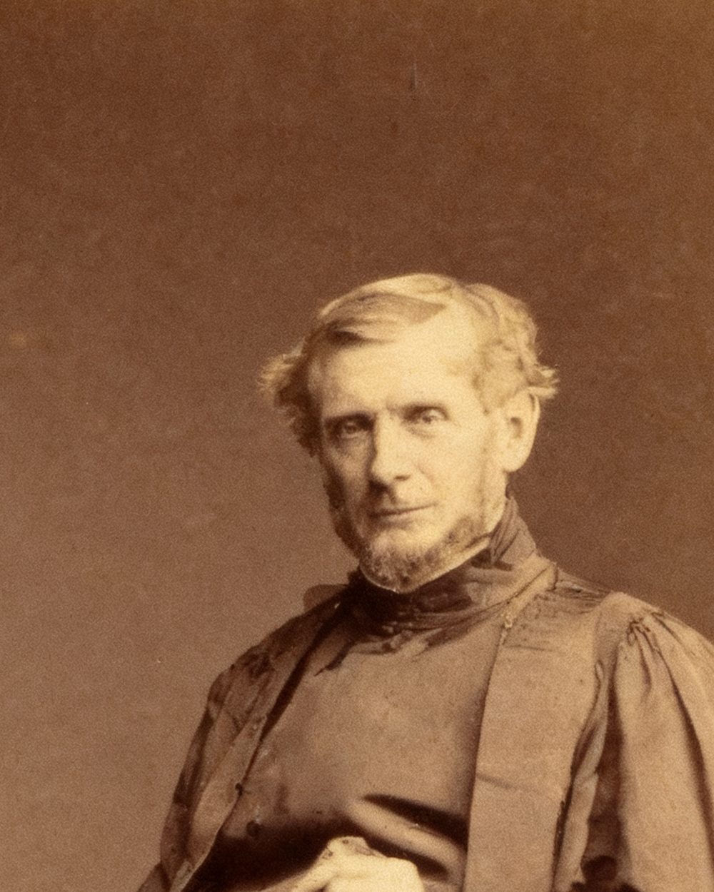 The same 1860s portrait fully restored: the clergyman's face, hands and robes are complete and the print looks undamaged.