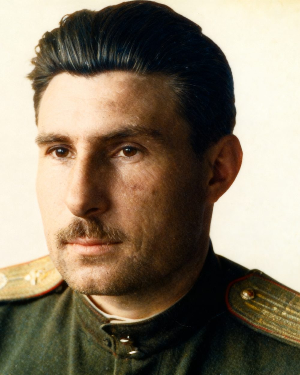 The same pilot in natural colour, his uniform green with gold shoulder boards.