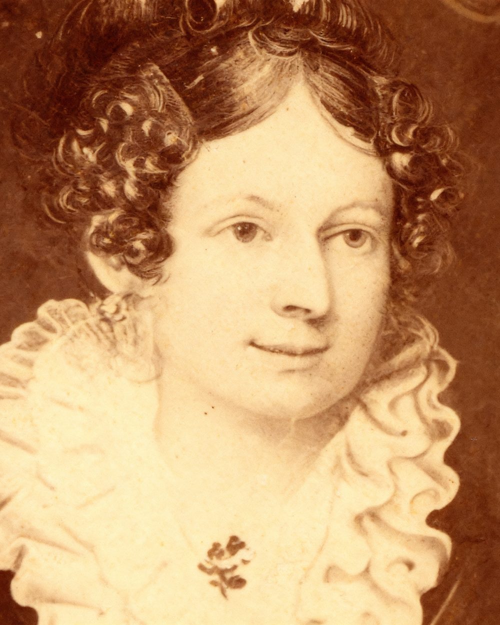 The same 1830s portrait restored: warm tone, clear features and detail returned to her hair and lace collar.